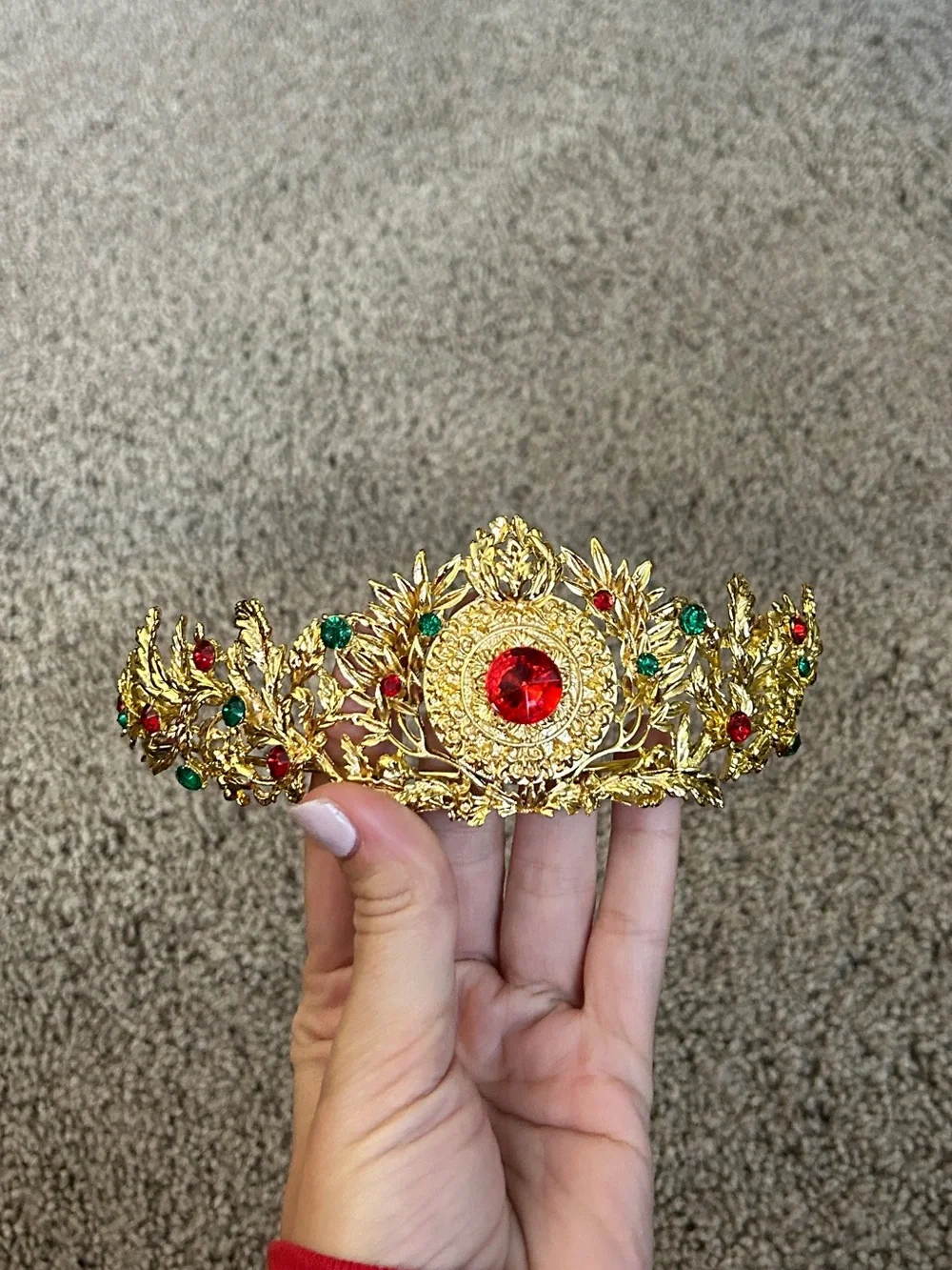 Gold colored crown headband with red and green faux gemstones